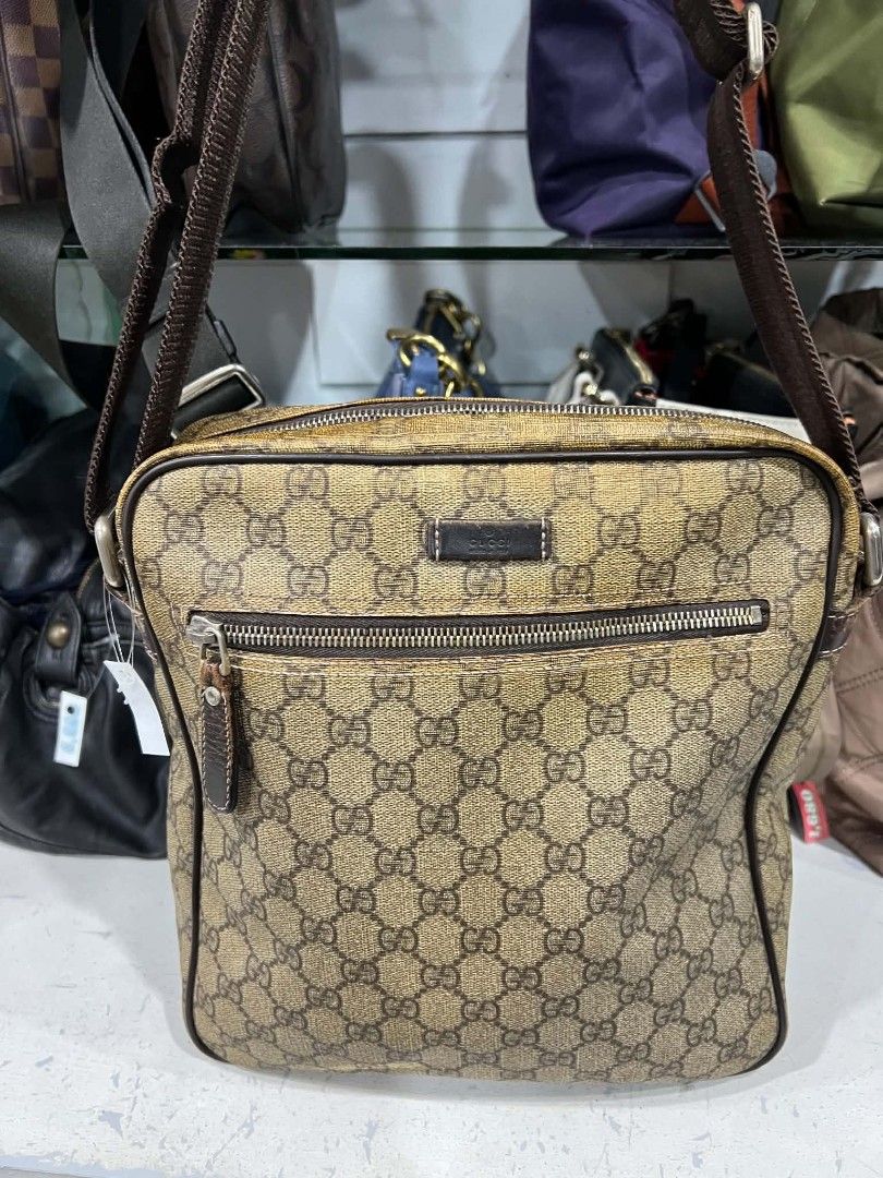 Gucci GG Supreme Messenger Bag 201448 (Category: Sling Bags) located in Urdaneta. Submitted by jayceegarage (Listing ID 1470501840, Image 3). Description: - Authentic Gucci messenger bag in classic GG Supreme canvas - Durable brown leather trim and adjustable fabric strap for shoulder or crossbody wear - Secure main zippered compartment and handy front zip pocket - Spacious interior for all your daily essentials - Serial number: 201448 506631 sta