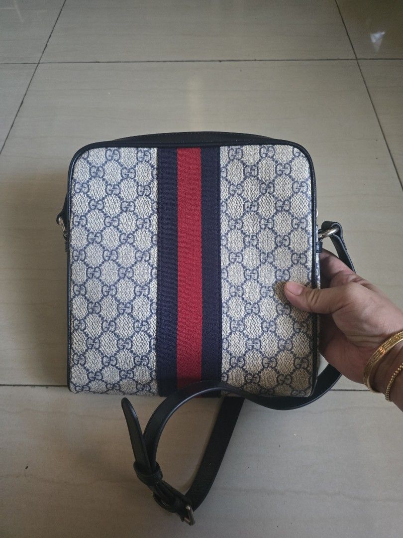 Gucci GG Supreme Messenger Bag (Category: Sling Bags) located in Manila. Submitted by brandedshoppe_mnl (Listing ID 1470554349, Image 2). Description: - Authentic Gucci messenger bag - Iconic GG Supreme canvas in beige and blue - Signature red and navy web stripe detail - Silver-tone Double G hardware - Vertical front zipper pocket for quick access - Premium black leather trim - Comfortable adjustable shoulder strap - Spacious main compartment wi