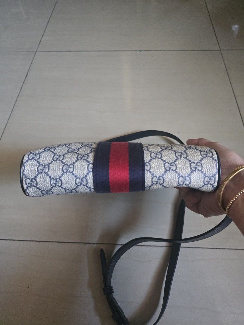 Gucci GG Supreme Messenger Bag (Category: Sling Bags) located in Manila. Submitted by brandedshoppe_mnl (Listing ID 1470554349, Image 3). Description: - Authentic Gucci messenger bag - Iconic GG Supreme canvas in beige and blue - Signature red and navy web stripe detail - Silver-tone Double G hardware - Vertical front zipper pocket for quick access - Premium black leather trim - Comfortable adjustable shoulder strap - Spacious main compartment wi