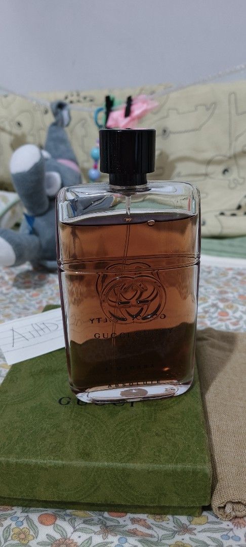 Gucci Guilty Absolute Pour Homme EDP (Category: Fragrance & Deodorants) located in Manila. Submitted by truetree-3c99a8 (Listing ID 1470488526, Image 2). Description: - Item: Gucci Guilty Absolute Pour Homme Eau de Parfum - Condition: Full level, well-stored away from direct sunlight - Inclusion: Complete with original green patterned box and fabric pouch - Bottle Details: Rectangular glass with black cap and embossed interlocking G logo - Fragra