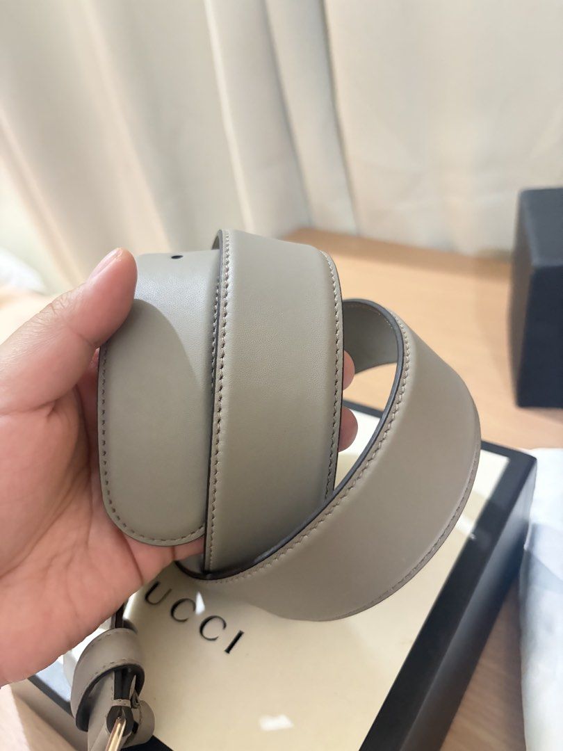 Gucci Interlocking G Grey Leather Belt (Category: Belts) located in Iloilo. Submitted by miafinds (Listing ID 1470386742, Image 2). Description: - Brand: Gucci - Color: Grey leather - Hardware: Gold interlocking G buckle - Size: 95-38 - Condition: Clean strap with minimal wear on buckle - Details: Serial number stamped on inside strap - Inclusions: Original Gucci box included.