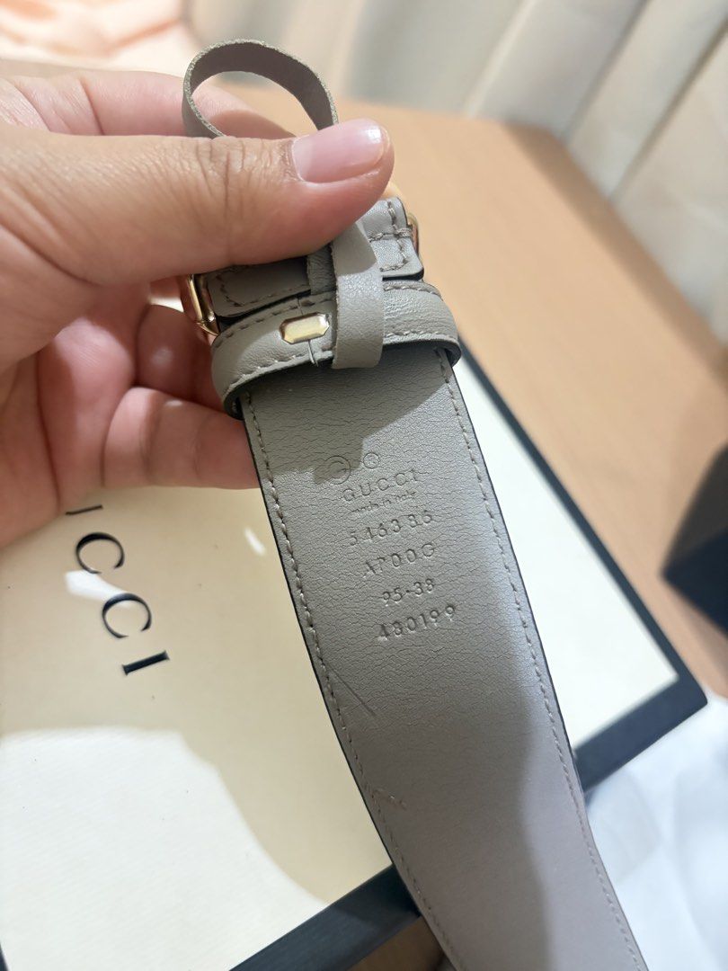 Gucci Interlocking G Grey Leather Belt (Category: Belts) located in Iloilo. Submitted by miafinds (Listing ID 1470386742, Image 3). Description: - Brand: Gucci - Color: Grey leather - Hardware: Gold interlocking G buckle - Size: 95-38 - Condition: Clean strap with minimal wear on buckle - Details: Serial number stamped on inside strap - Inclusions: Original Gucci box included.