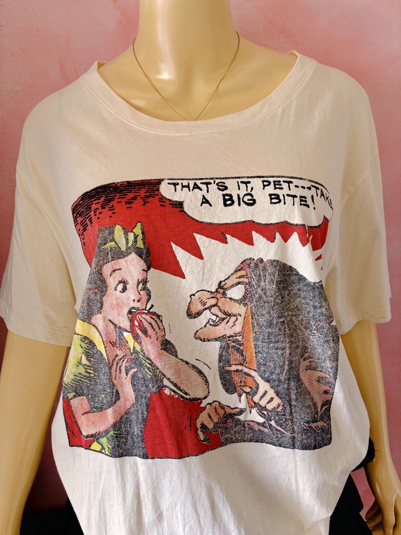 Gucci Snow White Comic Print T-shirt (Category: Shirts) located in Lipa City. Submitted by classyces24 (Listing ID 1470353228, Image 2). Description: - Brand: Gucci - Design: Snow White & Evil Queen comic book art style - Color: Cream - Size: XL - Details: Short sleeves, classic crew neckline - Origin: Made in Italy - Condition: Excellent, fun piece for casual wear.