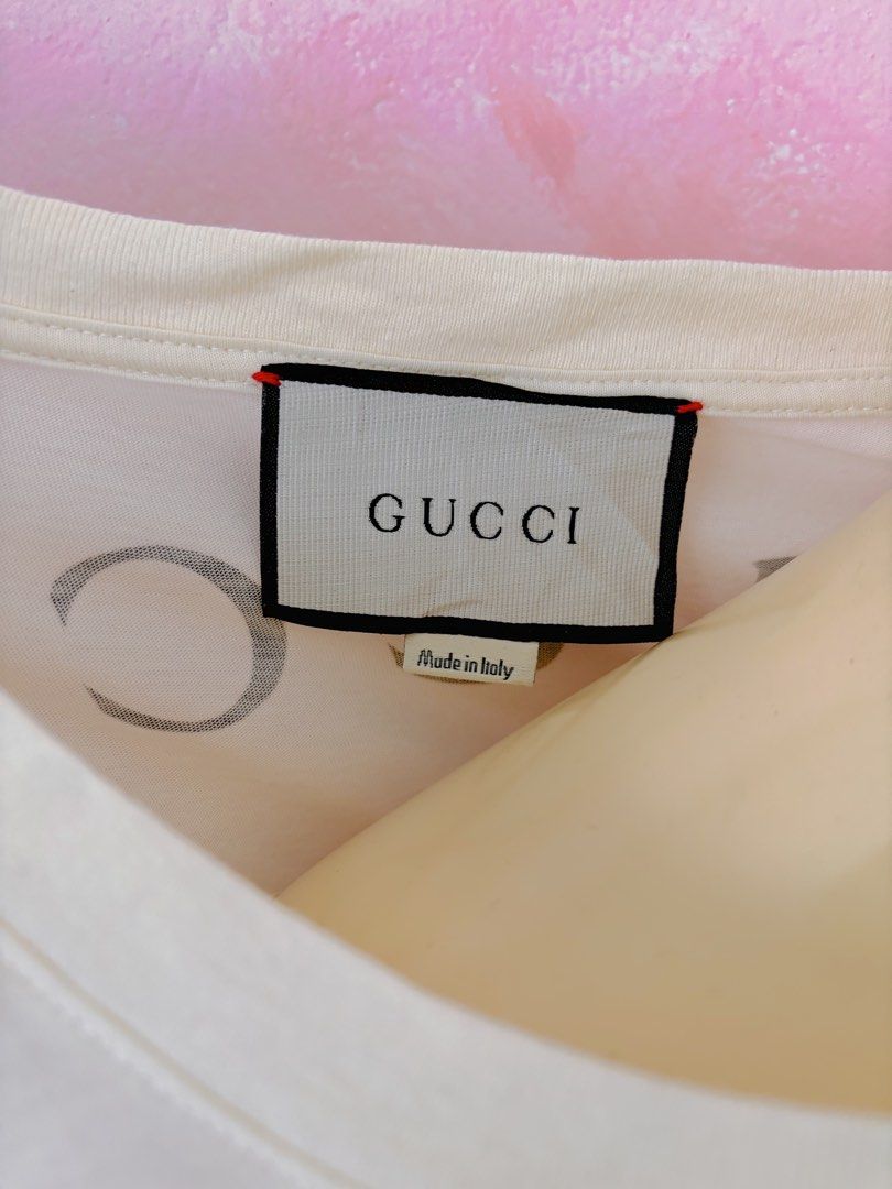 Gucci Snow White Comic Print T-shirt (Category: Shirts) located in Lipa City. Submitted by classyces24 (Listing ID 1470353228, Image 3). Description: - Brand: Gucci - Design: Snow White & Evil Queen comic book art style - Color: Cream - Size: XL - Details: Short sleeves, classic crew neckline - Origin: Made in Italy - Condition: Excellent, fun piece for casual wear.