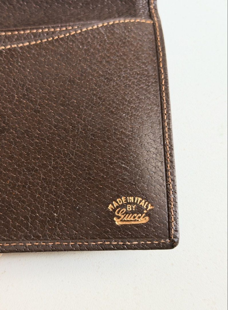 Gucci Vintage Monogram Canvas Long Wallet Brown (Category: Luxury Bags & Wallets) located in Quezon City. Submitted by official_kiyowo.vintage (Listing ID 1470351873, Image 3). Description: - Brand: Vintage Gucci - Material: Brown monogram canvas with dark brown leather trim - Hardware: Gold-tone front clasp closure - Interior: Dark brown leather with gold stamped 'Made in Italy by Gucci' logo - Storage: Multiple compartments for cards and cash -