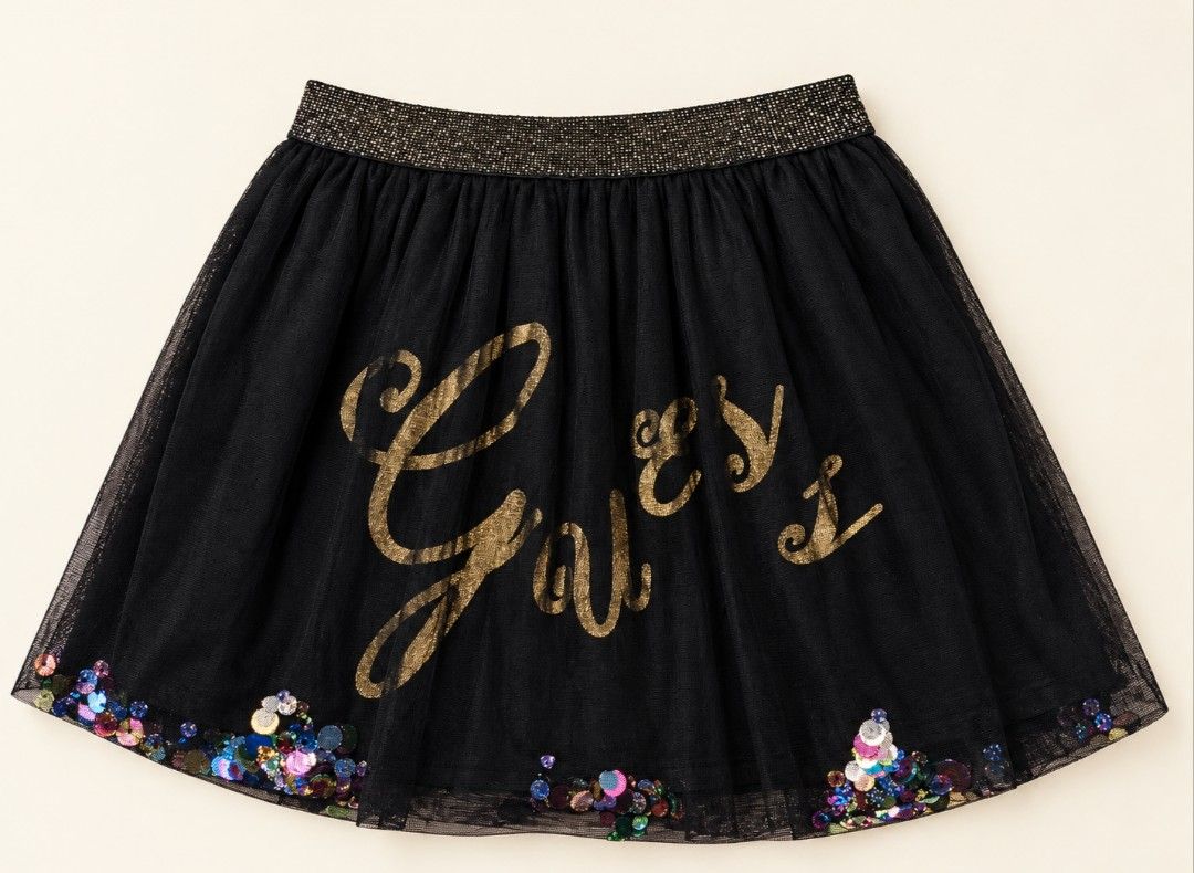 Guess Black Tutu Skirt with Sequins (Category: Skirts) located in Manila. Submitted by iamnicka (Listing ID 1470422557, Image 1). Description: - Authentic Guess black tulle tutu skirt - Features a chic gold signature logo across the front - Comfortable sparkly elastic waistband - Eye-catching multicolored sequins scattered along the bottom hem fits 7yrs old up - Flared, voluminous shape for maximum fun - Perfect for parties, special occasions, or