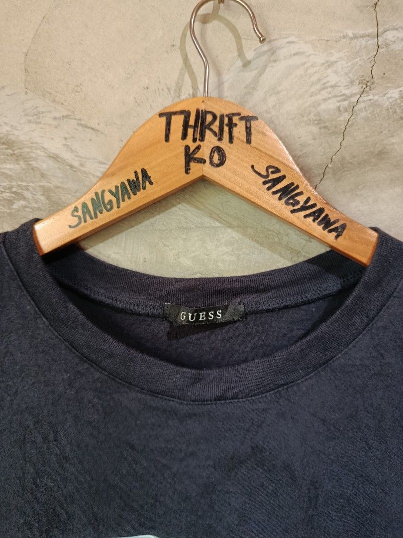 Guess Triangle Logo Black T-Shirt Size L (Category: Tshirts & Polo Shirts ) located in Kalamansig. Submitted by skone1996 (Listing ID 1470429094, Image 2). Description: - Brand: Guess - Style Number: NM2K9408 - Size: L - 20 Width - 27 Length - 9.8/10 Color rate - No issue - Material: 100% Cotton - Color: Black - Design: Classic Guess triangle logo with an iridescent finish, crew neck, short sleeves - Condition: Excellent, clean collar tag and int