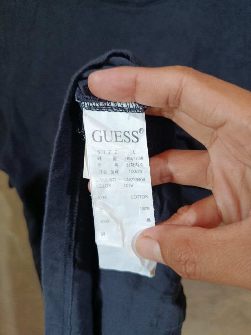 Guess Triangle Logo Black T-Shirt Size L (Category: Tshirts & Polo Shirts ) located in Kalamansig. Submitted by skone1996 (Listing ID 1470429094, Image 3). Description: - Brand: Guess - Style Number: NM2K9408 - Size: L - 20 Width - 27 Length - 9.8/10 Color rate - No issue - Material: 100% Cotton - Color: Black - Design: Classic Guess triangle logo with an iridescent finish, crew neck, short sleeves - Condition: Excellent, clean collar tag and int