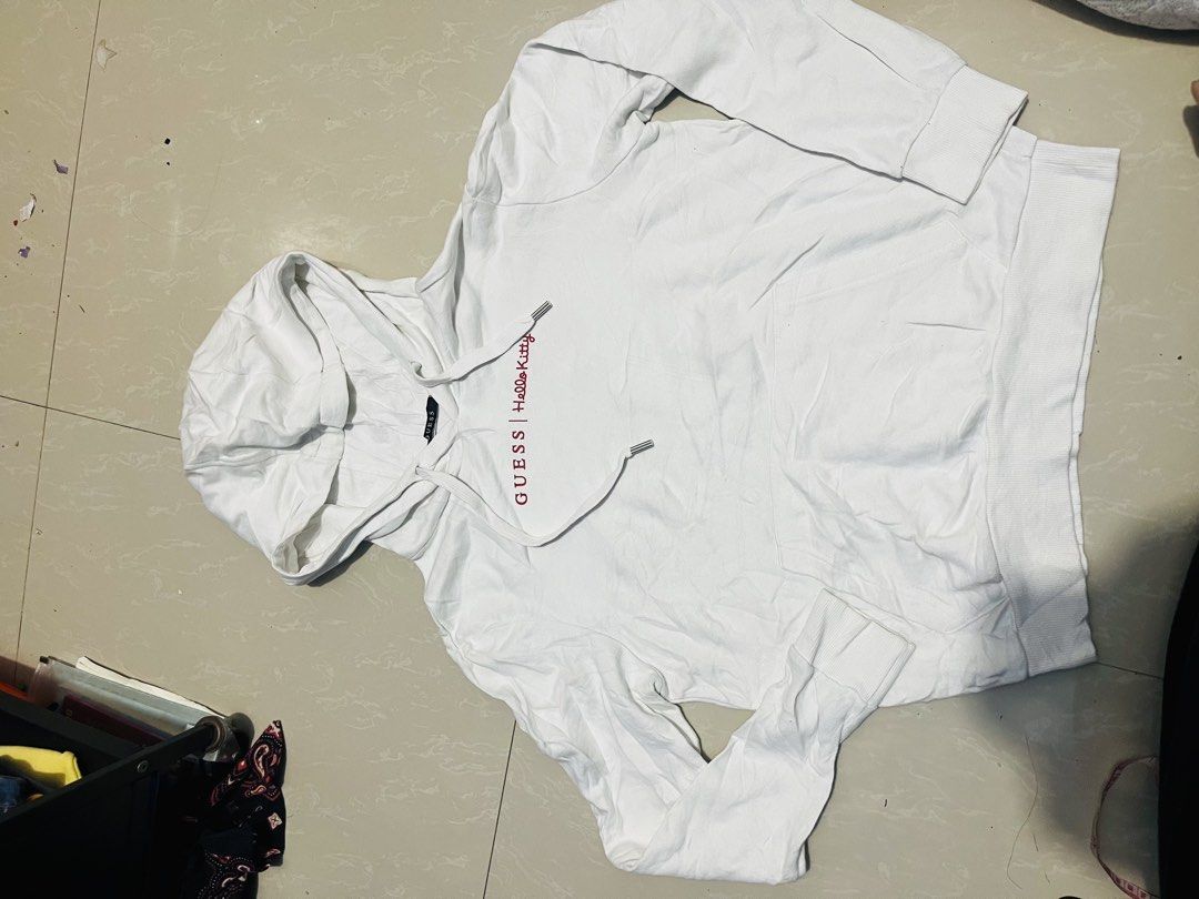 Guess x Hello Kitty White Hoodie Size S (Category: Coats, Jackets and Outerwear) located in Manila. Submitted by athan0800 (Listing ID 1470417845, Image 1). Description: Guess x Kitty white hoodie, size S. Style number MZ4K7775HK. 100% cotton body and hood lining. Red logo lettering across chest, large Guess triangle logo with Kitty graphics on the back. Drawstring hood, front kangaroo pocket. Ribbed cuffs and hem..