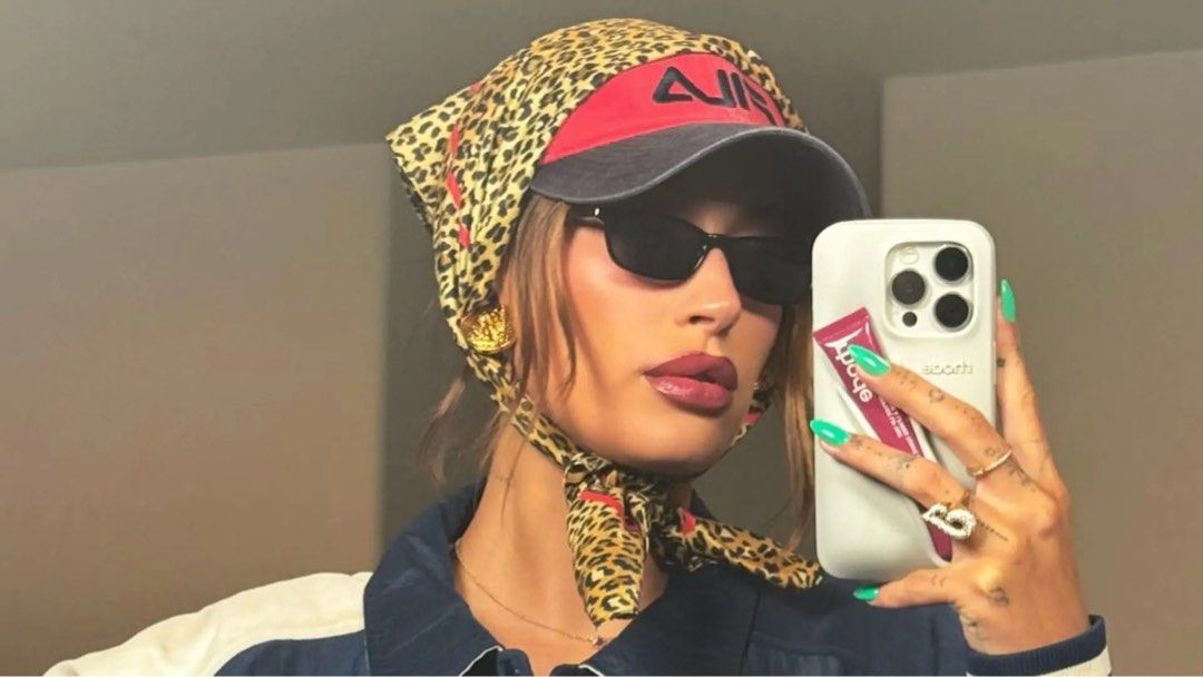 hailey bieber leopard silk scarf with red details (Category: Scarves) located in Manila. Submitted by _____car0usell (Listing ID 1470496127, Image 1). Description: - wear as a headscarf (hailey bieber style), neck scarf, or tie it to your handbag handle - never used, just for fitting.