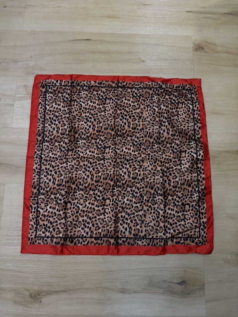 hailey bieber leopard silk scarf with red details (Category: Scarves) located in Manila. Submitted by _____car0usell (Listing ID 1470496127, Image 2). Description: - wear as a headscarf (hailey bieber style), neck scarf, or tie it to your handbag handle - never used, just for fitting.