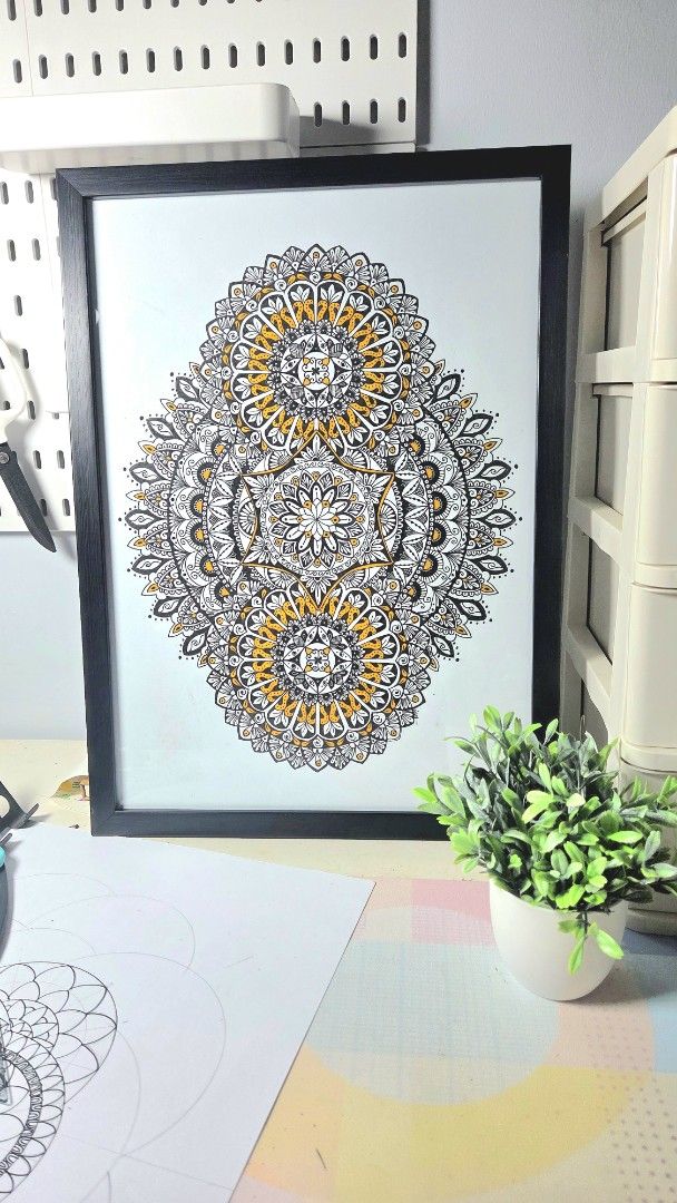 Handmade Mandala Art Piece in Black Frame (Category: Wall Decor) located in Dagupan City. Submitted by mysticwater_1982 (Listing ID 1470405030, Image 1). Description: - Hand-drawn geometric mandala artwork original creation - Detailed fine liner pen work in black, white, and yellow ink - Comes in a simple black frame, ready to hang or display - Unique handmade piece ideal for home or office decor - 4r paper/ frame size.