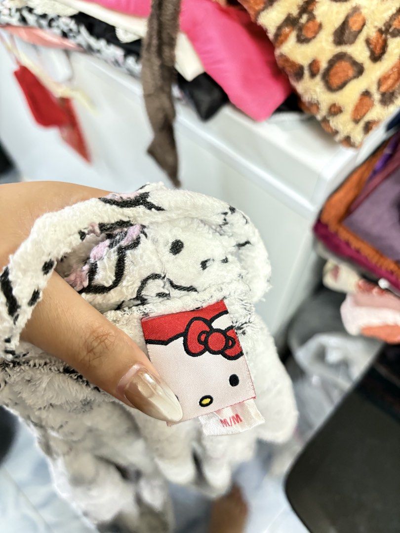 Hello Kitty Fluffy White Robe Bathrobe Size M (Category: Coats, Jackets and Outerwear) located in General Trias. Submitted by crissy9053136 (Listing ID 1470487716, Image 3). Description: - Authentic Kitty fleece bathrobe in white - Features all-over Sanrio character print and cute pink bows - Ultra-soft, warm, and cozy material ideal for sleepwear or lounging - Includes a shawl collar, functional front pockets, and a matching waist tie - Size: Me