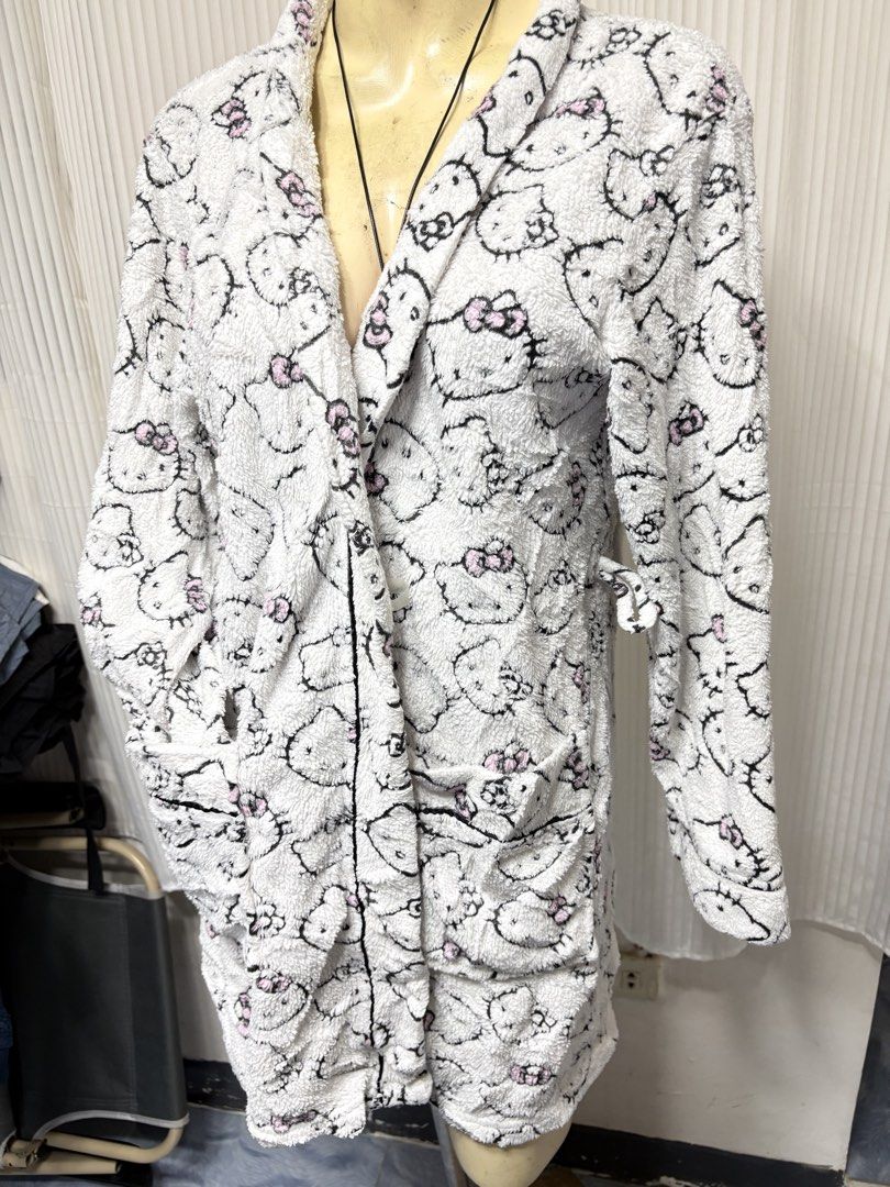 Hello Kitty Fluffy White Robe Bathrobe Size M (Category: Coats, Jackets and Outerwear) located in General Trias. Submitted by crissy9053136 (Listing ID 1470487716, Image 2). Description: - Authentic Kitty fleece bathrobe in white - Features all-over Sanrio character print and cute pink bows - Ultra-soft, warm, and cozy material ideal for sleepwear or lounging - Includes a shawl collar, functional front pockets, and a matching waist tie - Size: Me