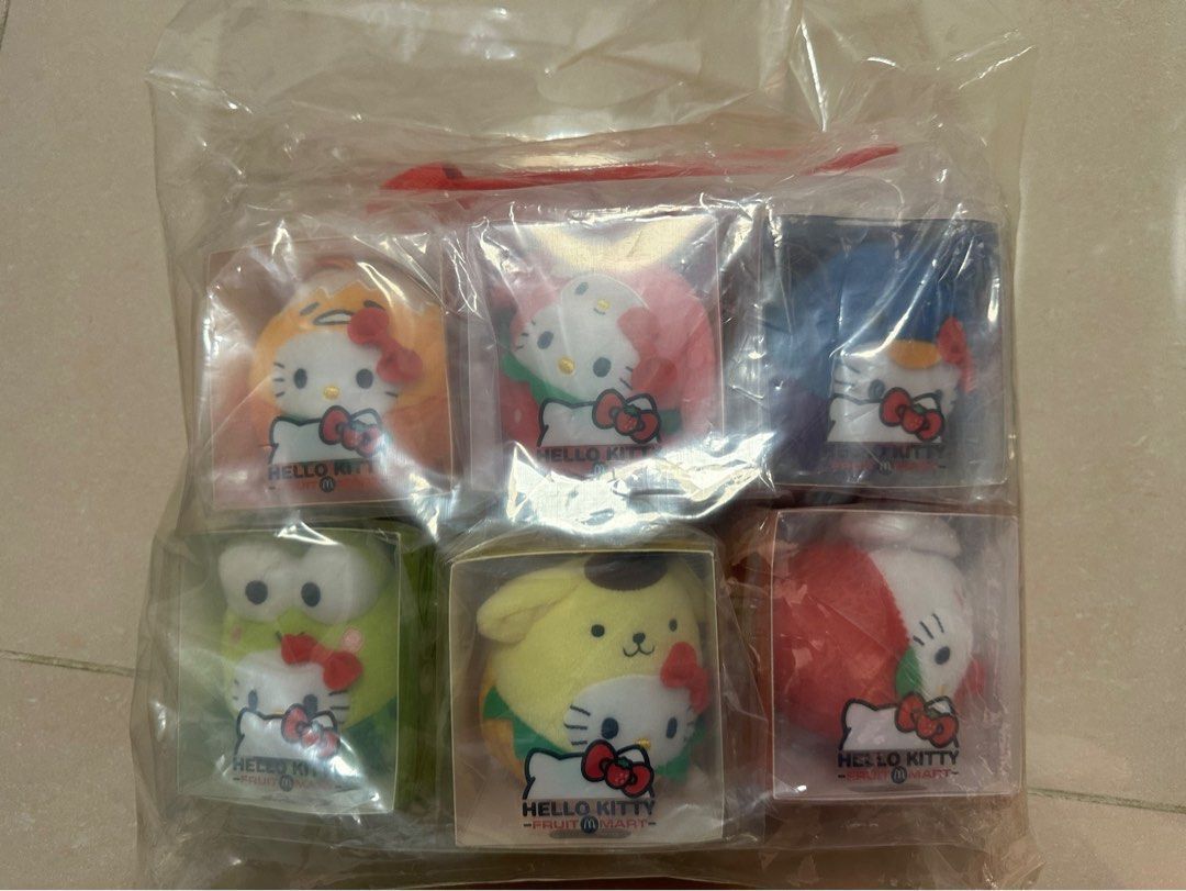 Hello Kitty Fruit Mart McDonald's Plush Set with Bag (Category: Plushies & Soft Toys) located in Mandaluyong City. Submitted by stuffandshop2017 (Listing ID 1470354300, Image 1). Description: - Complete set of 6 McDonald's Kitty Fruit Mart plush toys - Includes all characters in individual transparent packaging boxes - Brand new, untouched, and 100% sealed in original packaging - Comes with a matching branded Kitty canvas tote bag - Packed togeth