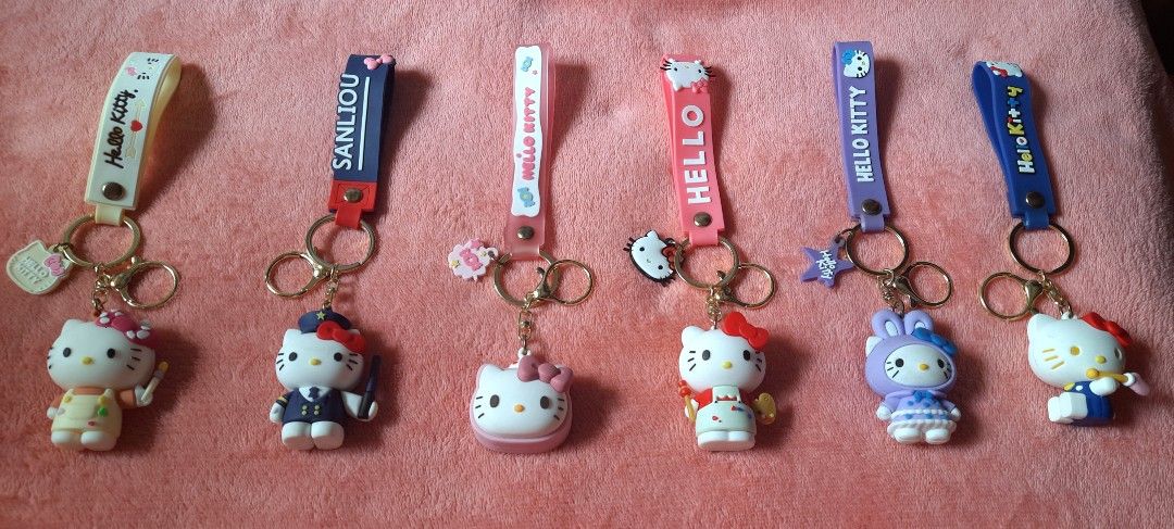 Hello Kitty Silicone Keychains Variety (Category: Character Goods) located in Manila. Submitted by declutter.mnla (Listing ID 1470366637, Image 1). Description: - 6 adorable Kitty designs available: Pilot, Painter, Bunny, and Shaped Pouches - Made of soft, high-quality silicone with durable metal rings and matching straps - Multi-purpose: Perfect accessories for bags, keys, lanyards, and backpacks - Makes a great gift for Hello Kitty fans -made o