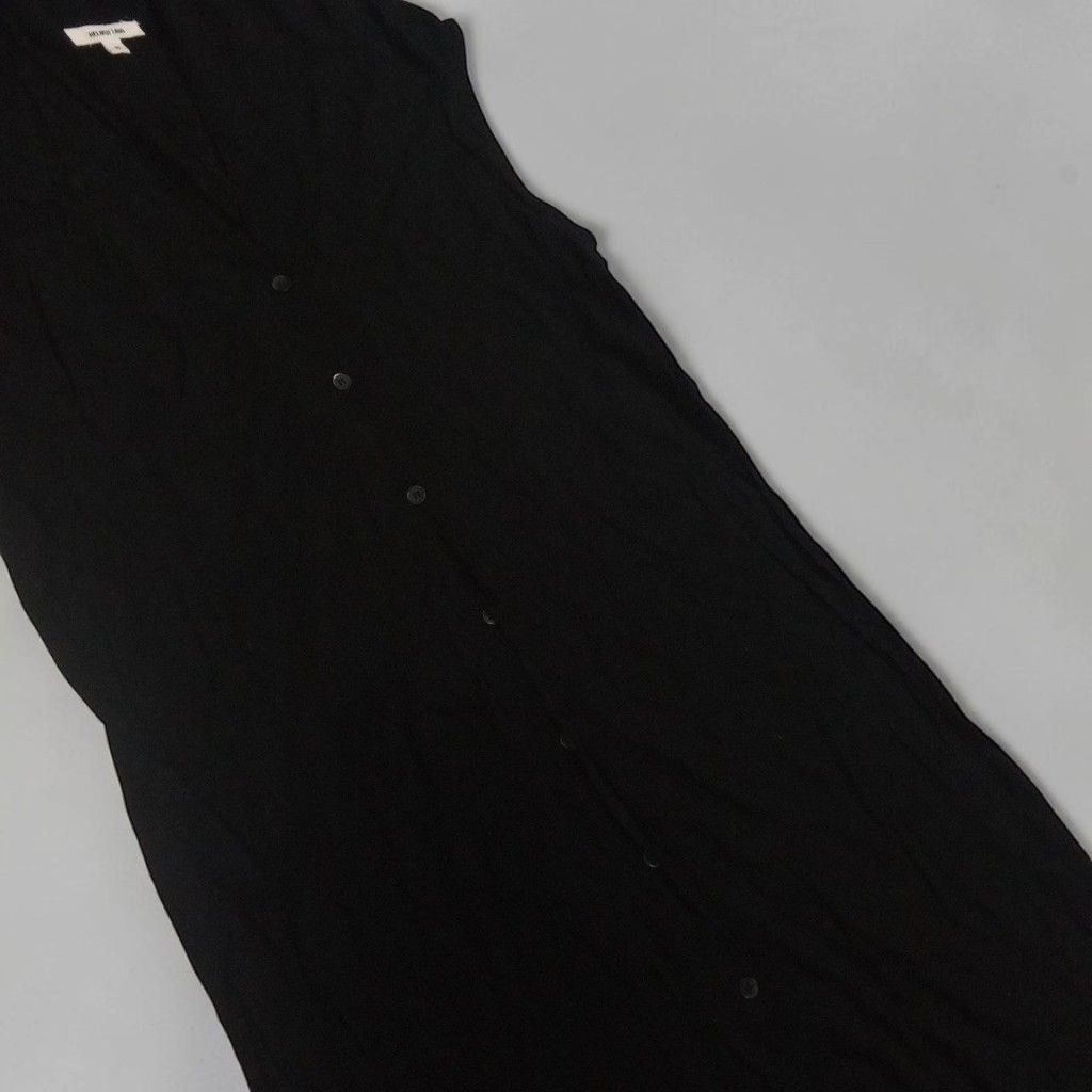 Helmut Lang - Button Down - Assymetrical Sleeveless - Dress (Category: Sleeveless) located in Manila. Submitted by grmnts_frmthe_slmz (Listing ID 1470392896, Image 2). Description: Helmut Lang sleeveless top in black. Front button closure running down the length. Unique asymmetric hemline hanging lower on one side. Lightweight knit material. Minimalist design Helmut Lang - Button Down - Assymetrical Sleeveless - Dress Dimes: 18.5 inches, Wdth 18 
