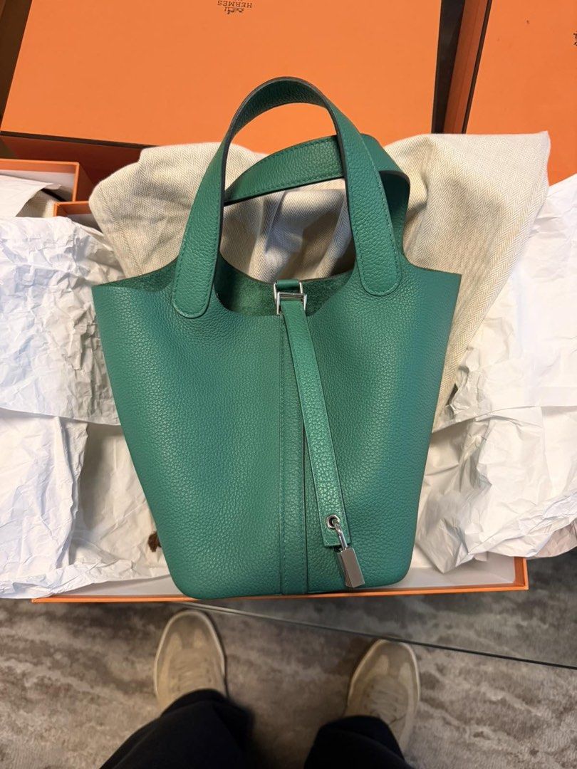 Hermes Picotin Lock Green Leather Handbag (Category: Luxury Bags & Wallets) located in Manila. Submitted by ariannelou20638 (Listing ID 1470414750, Image 1). Description: - Authentic Hermes green leather bucket bag - Elegant silver hardware with front strap padlock closure - Convenient dual top handles for easy carrying - Luxurious unlined suede interior - Comes complete with signature orange Hermes box and herringbone dust bag - PM for more deta