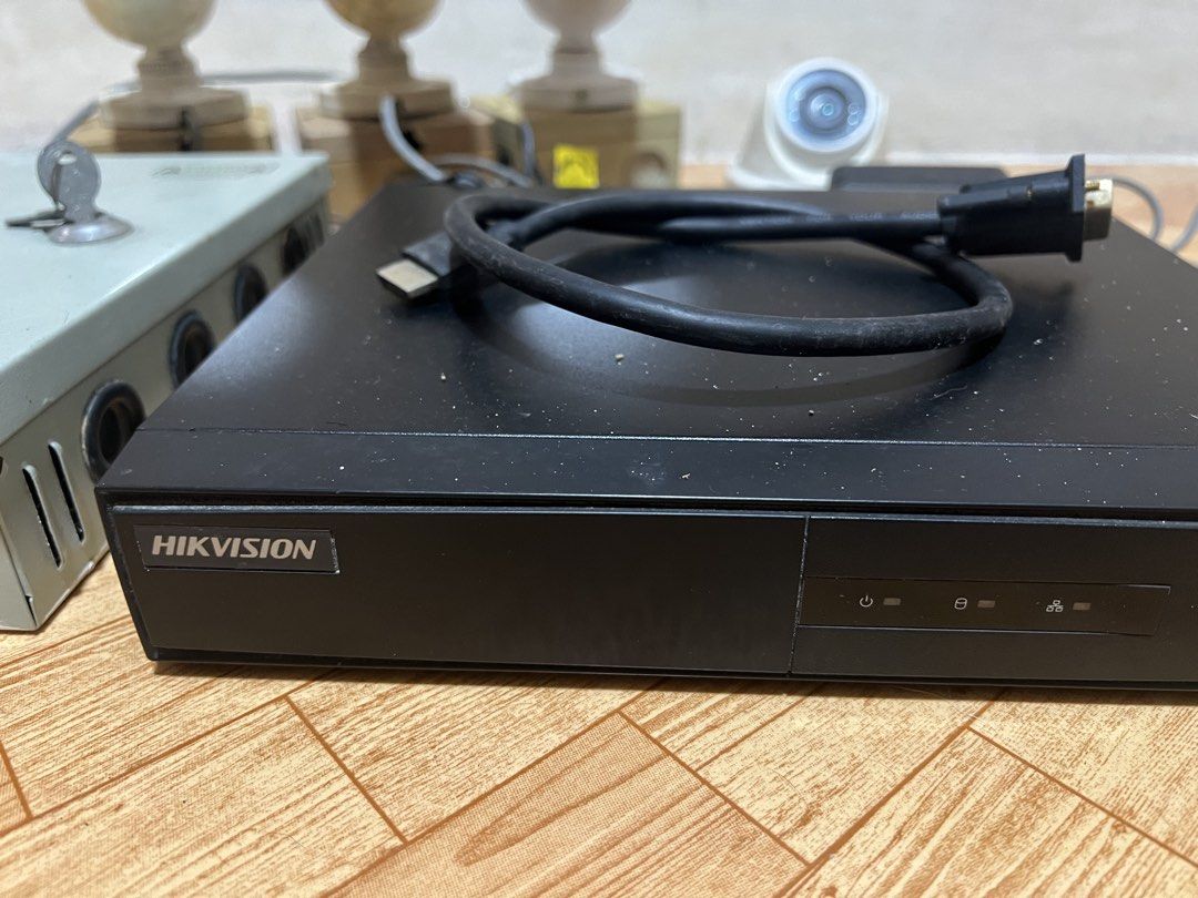 Hikvision DVR with Security Cameras and Power Supply Box (Category: Security Systems & CCTV Cameras) located in Malabon City. Submitted by demenice (Listing ID 1470392025, Image 2). Description: - Complete Hikvision DVR security system - Includes 4 bullet-style cameras and 1 dome camera - Comes with a metal power supply box (with key) and necessary cables - Tested and fully working - Shows minor cosmetic wear and dust from previous use - Ideal an