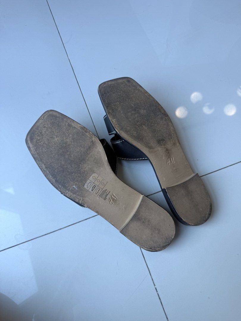 H&M Black Slide Sandals (Category: Flats & Sandals) located in Makati City. Submitted by bcazu (Listing ID 1470356404, Image 3). Description: H&M Sandals with contrast stitching (Hermes inspired) Size: 39 RFS: Used lightly - size too big for me - Color: Black with white contrast stitching - Design: Square toes, crossover upper straps, slip-on style - Perfect for casual daily outfits Meet up at Eastwood or delivery c/o buyer.