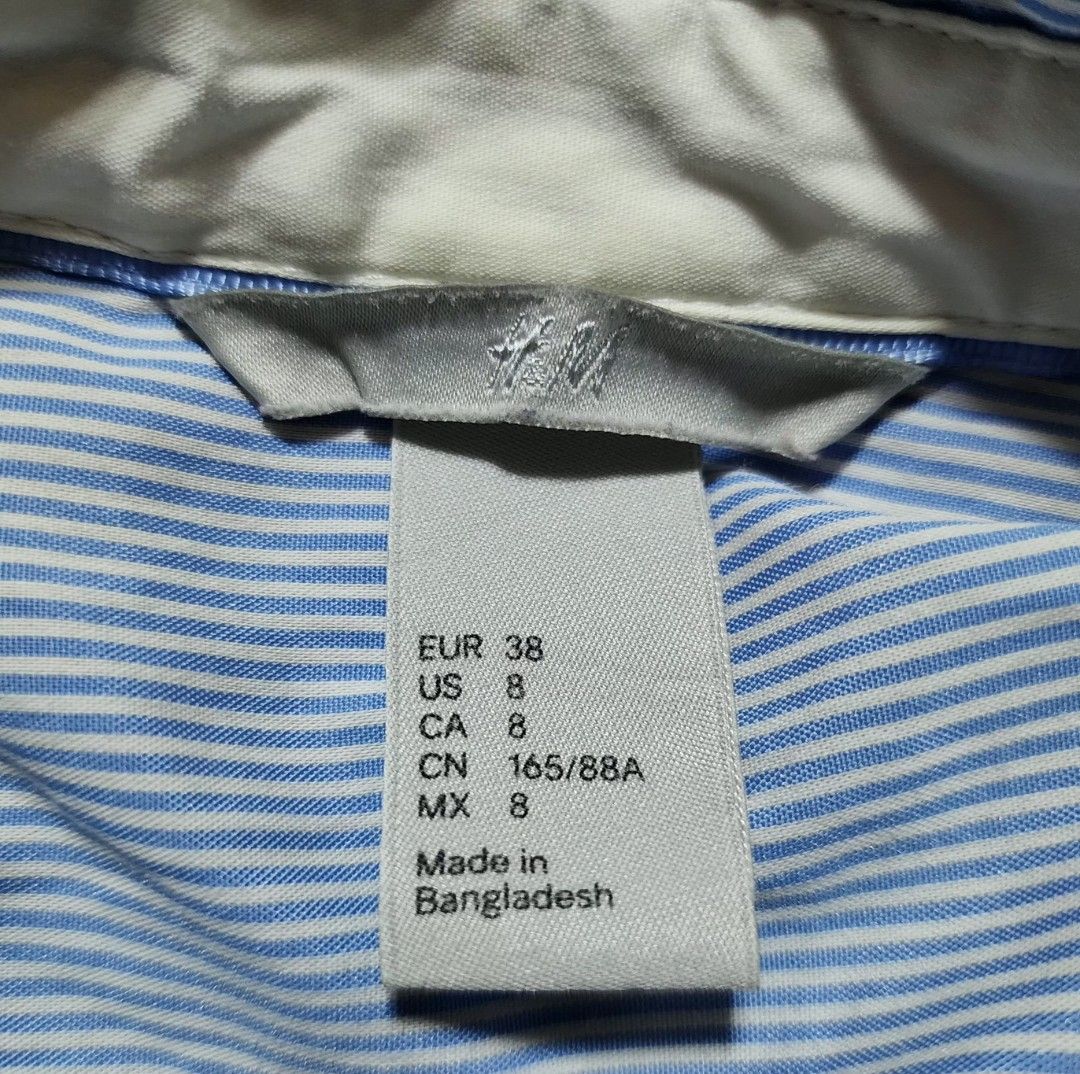 H&M Classic Blue & White Fine Striped Button-Down Shirt (Category: Coats, Jackets and Outerwear) located in Quezon City. Submitted by dolcegioia (Listing ID 1470368503, Image 2). Description: ​Brand: H&M ​Color: Light Blue & White (Pinstripe / Micro-stripe) ​Size: US 8 / EUR 38 / CA 8 / MX 8 / CN 165/88A -It can fit Small to Medium size ​Style: Fitted / Tailored Long Sleeve Button-Up Shirt with White Inner Collar Accent ​Country of Manufacture: M