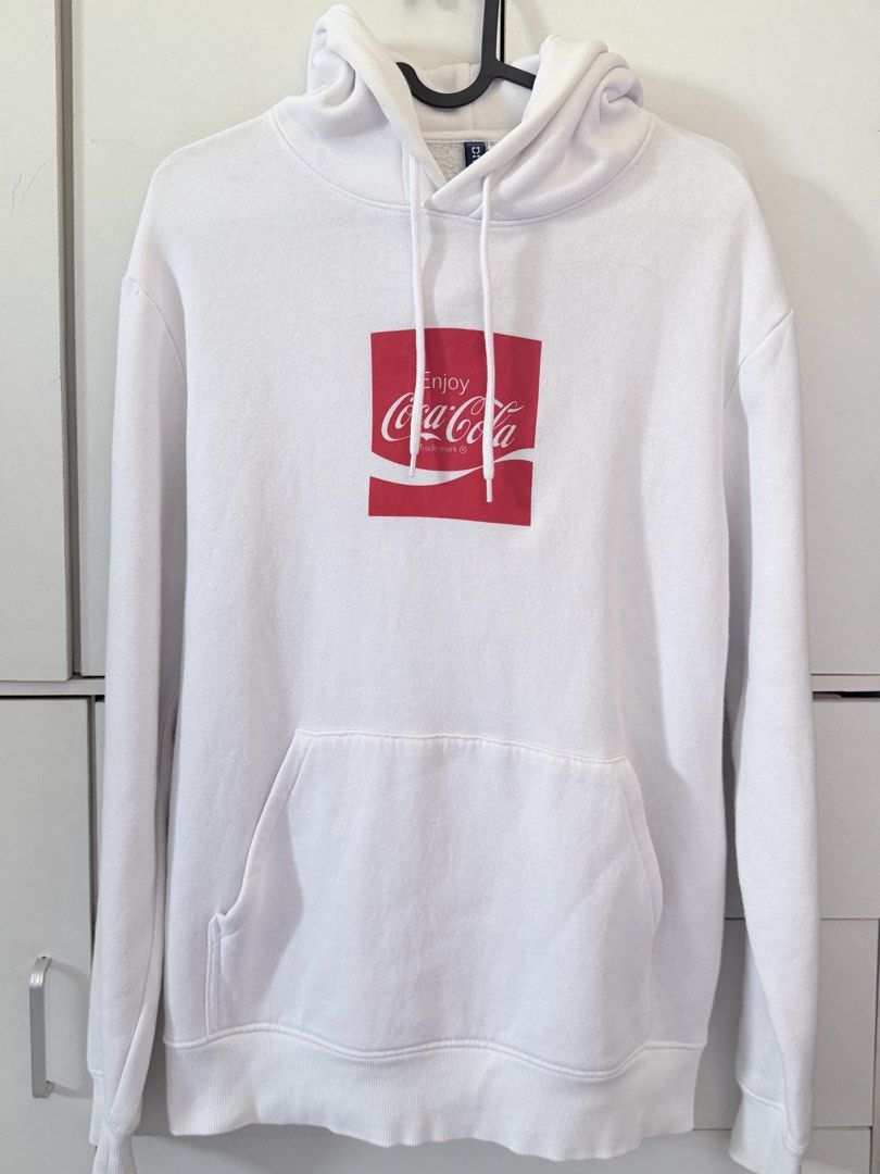 H&M Divided Coca Cola White Hoodie Size S (Category: Hoodies) located in Binan City. Submitted by wornbygwen (Listing ID 1470489749, Image 2). Description: - Brand: H&M Divided - Design: Coca Cola chest graphic - Color: Clean white - Size: S (EUR/UK S, CN 165/92A) - Features: Drawstring hood, front kangaroo pocket - Fit: Classic relaxed fit, super comfortable for daily wear - Condition: Well-maintained.