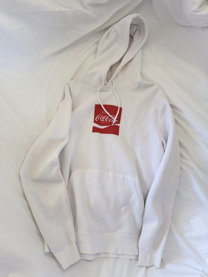 H&M Divided Coca Cola White Hoodie Size S (Category: Hoodies) located in Binan City. Submitted by wornbygwen (Listing ID 1470489749, Image 1). Description: - Brand: H&M Divided - Design: Coca Cola chest graphic - Color: Clean white - Size: S (EUR/UK S, CN 165/92A) - Features: Drawstring hood, front kangaroo pocket - Fit: Classic relaxed fit, super comfortable for daily wear - Condition: Well-maintained.