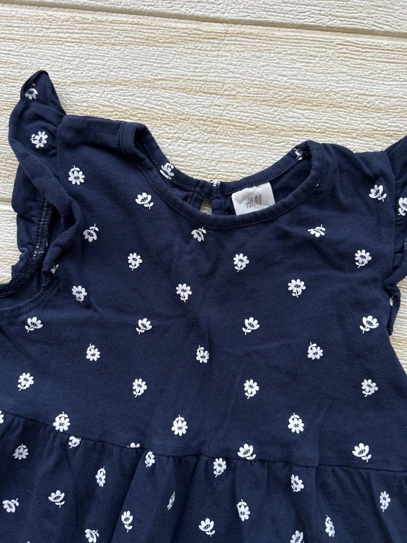 H&M soft cotton dress (Category: Babies & Kids Fashion) located in Cebu City. Submitted by yjainani (Listing ID 1470440053, Image 2). Description: navy blue soft cotton jersey dress with a small white floral or daisy print and ruffled flutter sleeves .