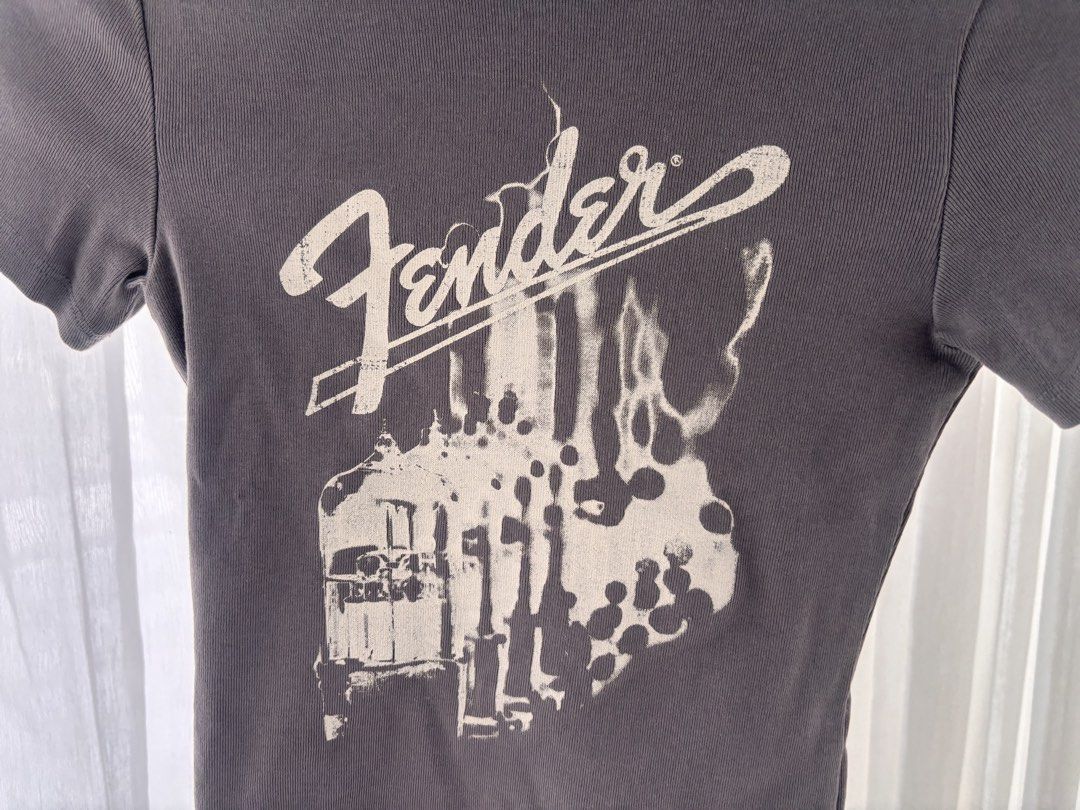 H&M x Fender graphic shirt (Category: Shirts) located in Manila. Submitted by gothclaudia (Listing ID 1470422320, Image 2). Description: RFS: decluttering my closet! :) - bought in 2023, hardly used since - H&M Divided - size XS - Fitted crewneck, short sleeves, cinched waist, stretchy cotton blend - good for casual band fashion!.