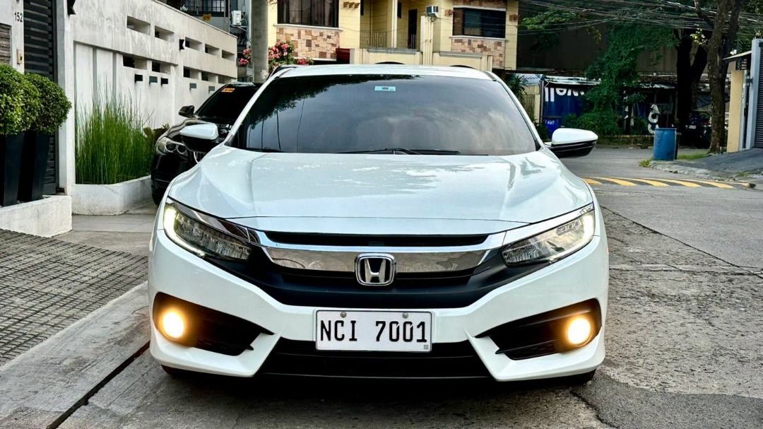 Honda Civic 1.8 (A) (Category: Used Cars) located in Pasig City. Submitted by denciosautohaus (Listing ID 1470463482, Image 2). Description: More pictures and reviews at Facebook Page - Dencio’s Auto Haus. 2016 Honda Civic 1.8E A/T 31tkms ONLY!! FULL Casa Records since day one!! Very OC owner!! 😊 All PMS receipts are properly filed in a folder. New PMS as well at Honda (Oct 2026) Complete with Owners Manual, Duplicate Remote Key, Tools, and Spar