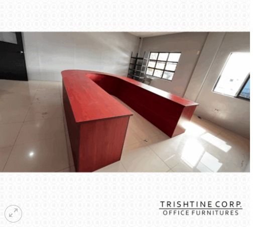 Horseshoe Shaped Conference Table (Category: Office Furniture & Fixtures) located in Caloocan City. Submitted by jim.trishtineofficefurnitures (Listing ID 1470433940, Image 1). Description: - Massive U-shaped office desk with a sleek reddish-brown wood finish - Generous workspace and counter space, ideal for multi-monitor setups or multiple staff members - Sturdy, heavy-duty construction with a durable surface for long-lasting use - Wraparound de