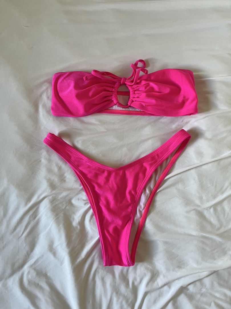 Hot Pink Swimsuit (Category: Bikinis & Swimsuits) located in Taytay. Submitted by prelovedbyblaire (Listing ID 1470384644, Image 1). Description: - Hot pink bikini set - Size: S (tag attached) - Style: Bandeau top with center ring detail and high-cut bottoms - Material: 80% polyamide, 20% elastane - Care: Wash dark colors separately - Condition: Brand new.