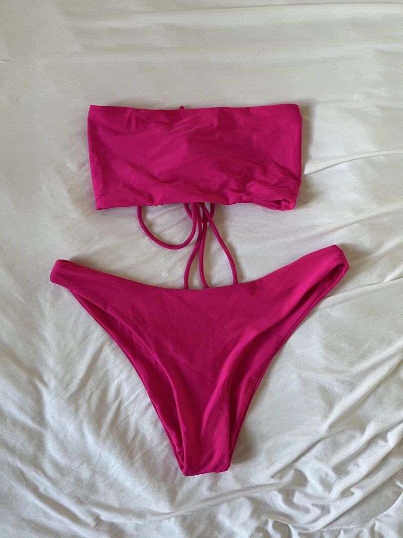 Hot Pink Two-Piece Swimsuit (Category: Bikinis & Swimsuits) located in Taytay. Submitted by prelovedbyblaire (Listing ID 1470385069, Image 1). Description: - Color: Vibrant hot pink - Style: Two-piece bandeau top with adjustable front tie strings and matching high-cut bottoms - Condition: Like new, pristine fabric with zero signs of wear - Perfect for: Beach trips, pool parties, and vacations.