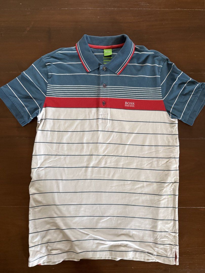 Hugo Boss Polo Shirt (Category: Tshirts & Polo Shirts ) located in Angeles City. Submitted by gillian_a (Listing ID 1470420614, Image 1). Description: Color: Blue/Red/White stripes Size: L (Slim Fit) Slightly faded Check photos for dimensions/measurements.
