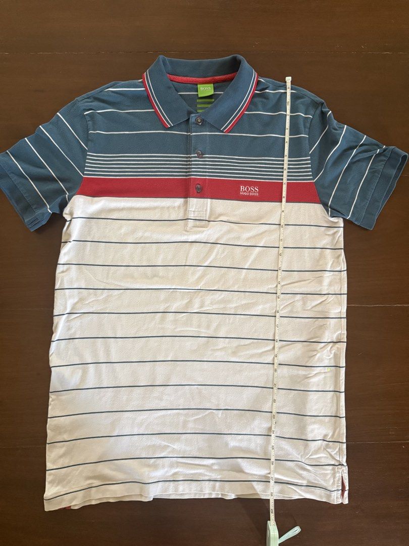 Hugo Boss Polo Shirt (Category: Tshirts & Polo Shirts ) located in Angeles City. Submitted by gillian_a (Listing ID 1470420614, Image 2). Description: Color: Blue/Red/White stripes Size: L (Slim Fit) Slightly faded Check photos for dimensions/measurements.