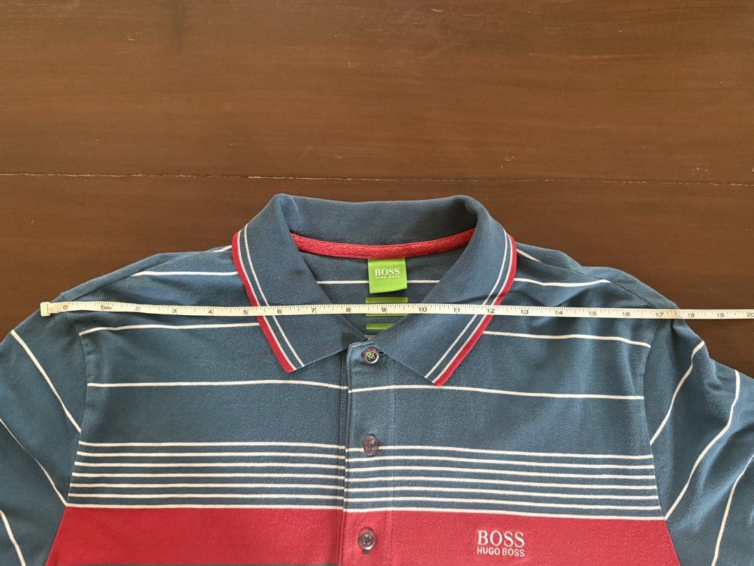 Hugo Boss Polo Shirt (Category: Tshirts & Polo Shirts ) located in Angeles City. Submitted by gillian_a (Listing ID 1470420614, Image 3). Description: Color: Blue/Red/White stripes Size: L (Slim Fit) Slightly faded Check photos for dimensions/measurements.