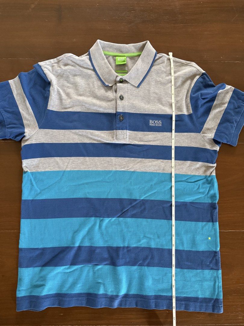 Hugo Bosss Polo Shirt (Category: Tshirts & Polo Shirts ) located in Angeles City. Submitted by gillian_a (Listing ID 1470419942, Image 2). Description: Color: Blue with Grey stripes Size: M (modern Fit) No defects Check photos for dimensions/measurements.