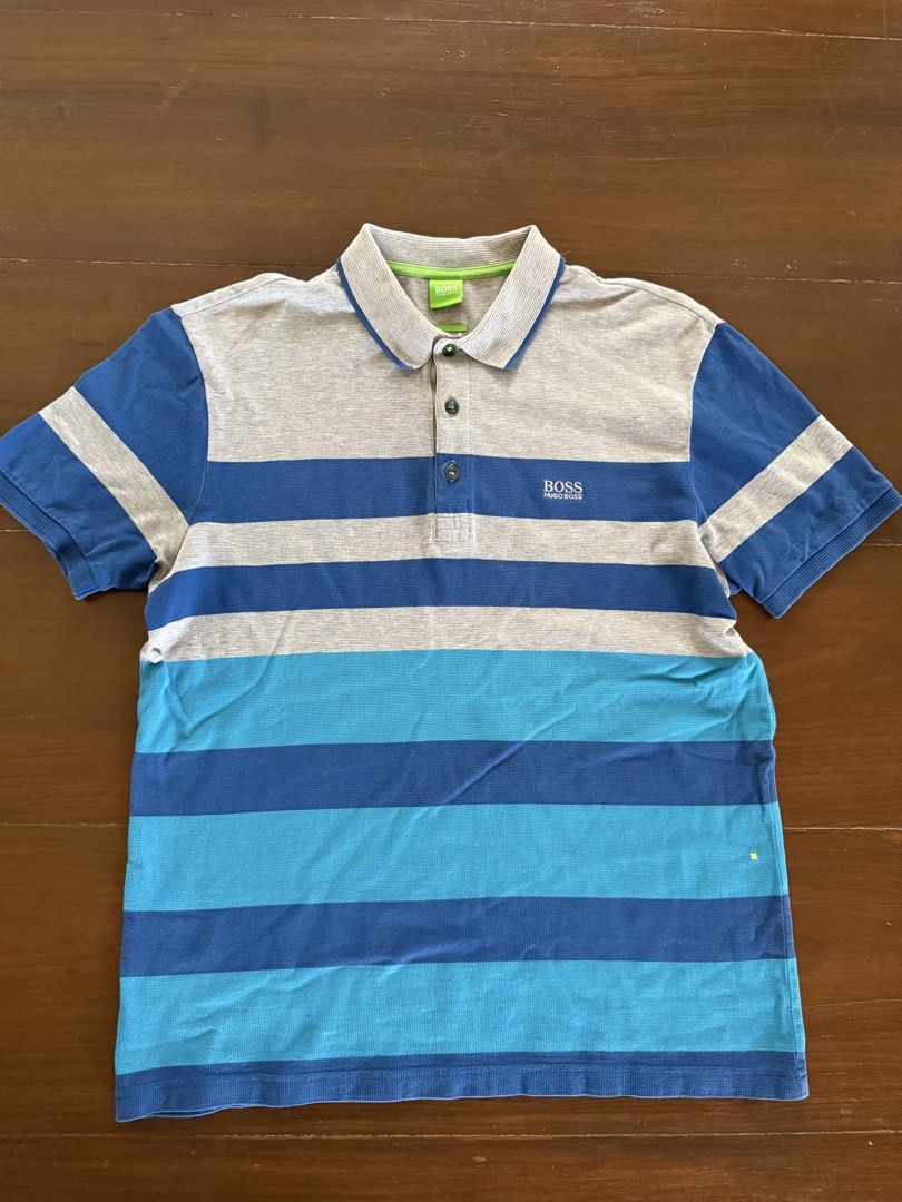 Hugo Bosss Polo Shirt (Category: Tshirts & Polo Shirts ) located in Angeles City. Submitted by gillian_a (Listing ID 1470419942, Image 1). Description: Color: Blue with Grey stripes Size: M (modern Fit) No defects Check photos for dimensions/measurements.