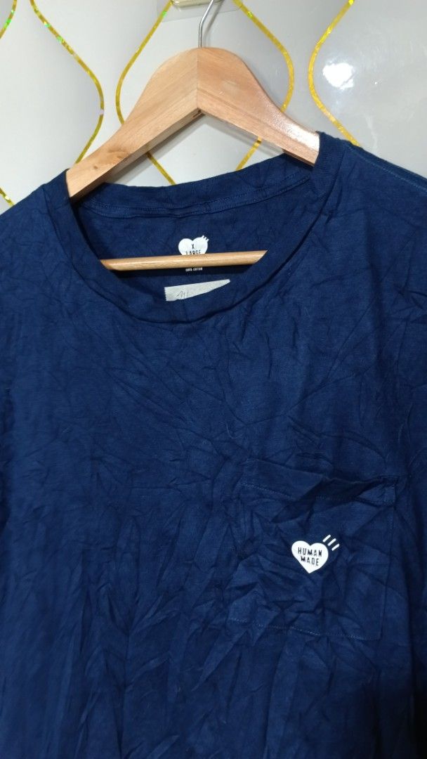 Human Made Navy Blue Pocket T-shirt (Category: Tshirts & Polo Shirts ) located in Manila. Submitted by zariyah.1986 (Listing ID 1470444398, Image 3). Description: - Brand: Human Made - Item: Pocket T-Shirt - Color: Navy Blue - Size: X-Large (Measures 24" x 28" laying flat) - Material: 100% Cotton - Details: Small heart logo on chest pocket, printed inner neck label - Model Code: HM29CS043 - Condition: Like new.