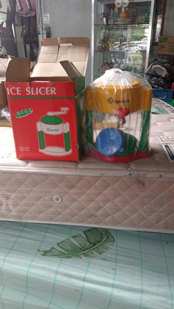 Ice Slicer Manual Shaver with Box (Category: Juicers, Blenders & Grinders) located in Manila. Submitted by wisegem-231b (Listing ID 1470424031, Image 1). Description: - Retro-style manual ice slicer machine with original red and green box - Features a vibrant yellow top, transparent middle container, and red base - Includes an internal blue component - Easy hand-crank operation with no electricity needed - Perfect for making homemade halo-halo, s