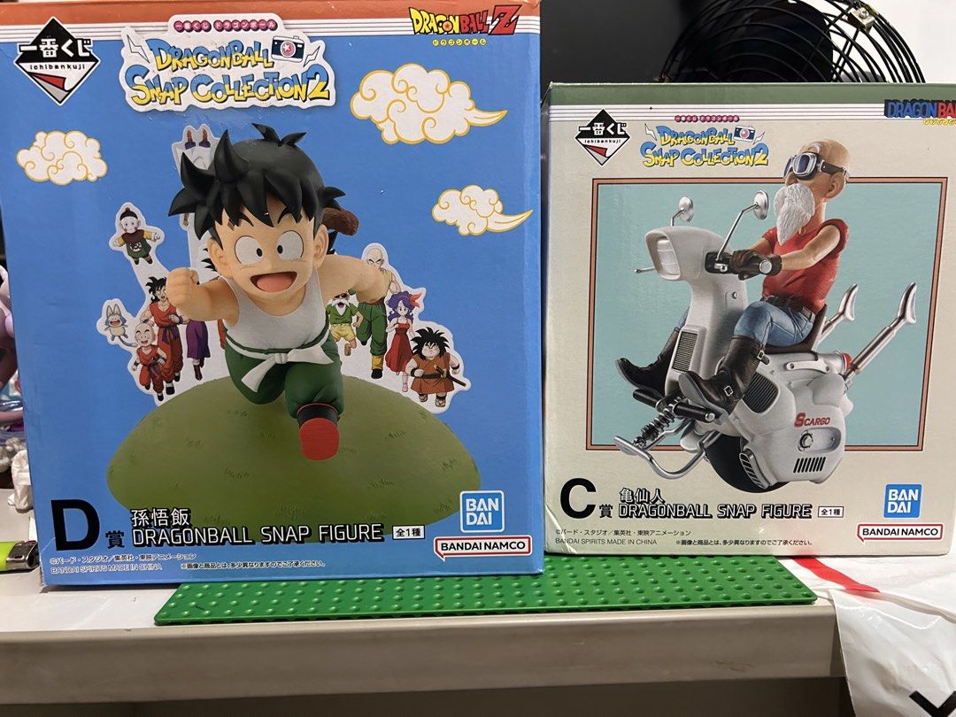 Ichiban Kuji Dragon Ball Snap Collection 2 Figures (Category: Figurines & Statues) located in Victoria. Submitted by pisangpaulotoys (Listing ID 1470525665, Image 2). Description: - Authentic Ichiban Kuji Dragon Ball Snap Collection 2 figures - Includes C Prize: Master Roshi on scooter - Includes D Prize: Kid Gohan running - Both items come with original boxes - Clean and well-kept condition - Perfect addition to any Dragon Ball collection.