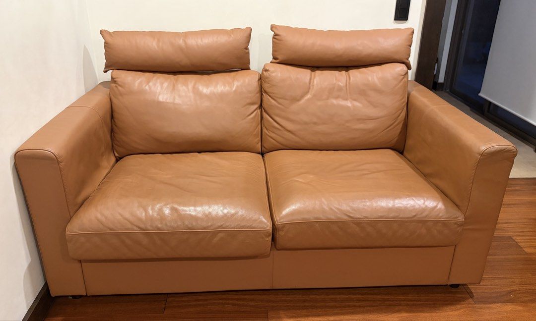 Ikea Vimle Tan leather 2-seater sofa with headrests (Category: Sofas) located in Taguig. Submitted by ellejay8 (Listing ID 1470551287, Image 1). Description: - Type: tan leather 2-seater sofa - Color: Warm caramel brown - Comfort: Deep cushions, wide armrests, and separate bolster headrests for neck support - Design: Clean, minimal aesthetic with a sturdy frame - Ideal For: Living rooms, studies, or compact spaces.