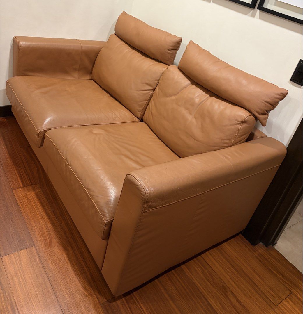 Ikea Vimle Tan leather 2-seater sofa with headrests (Category: Sofas) located in Taguig. Submitted by ellejay8 (Listing ID 1470551287, Image 2). Description: - Type: tan leather 2-seater sofa - Color: Warm caramel brown - Comfort: Deep cushions, wide armrests, and separate bolster headrests for neck support - Design: Clean, minimal aesthetic with a sturdy frame - Ideal For: Living rooms, studies, or compact spaces.
