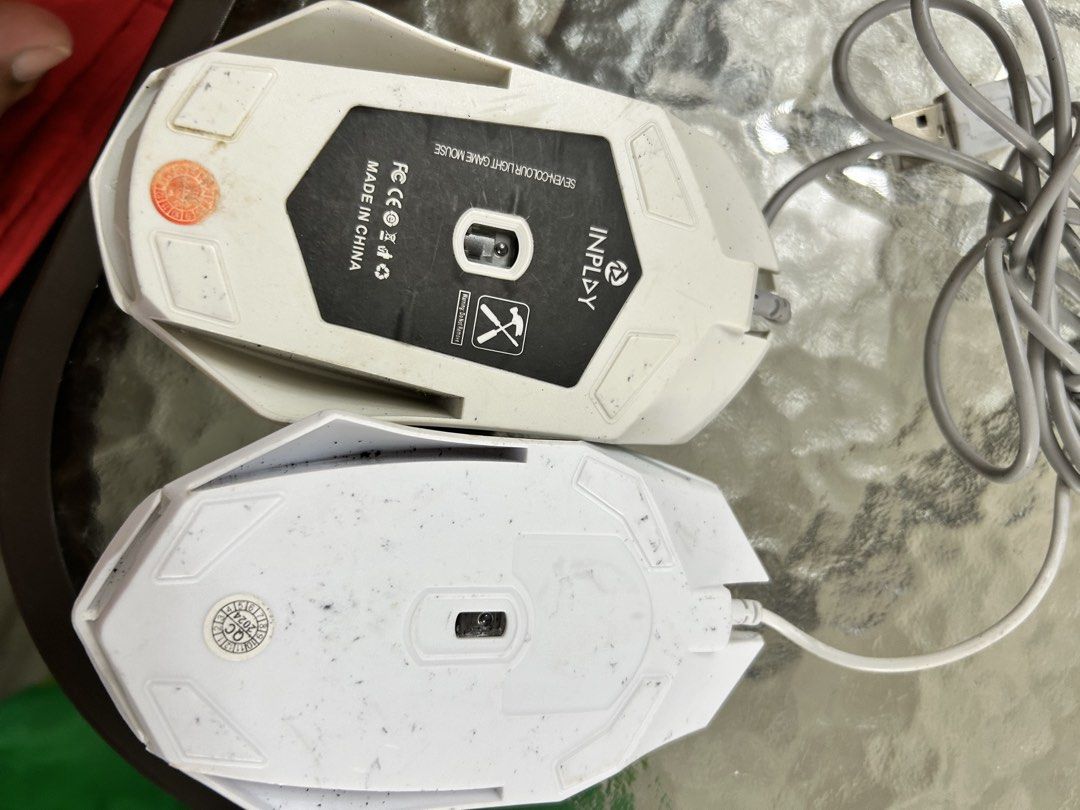 Inplay and Zeus Wired Gaming Mice Bundle (Category: Mouse & Mousepads) located in Cavite. Submitted by jm_gutierrez (Listing ID 1470385634, Image 2). Description: - Bundle includes 2 white wired gaming mice: Inplay (7-color LED lights) and Zeus - Standard USB plug-and-play connections - Condition: Pre-owned with visible dirt, scuffs, and handling marks from regular usage - Fully functional and sold as a pair - Great budget backup or starter mice.