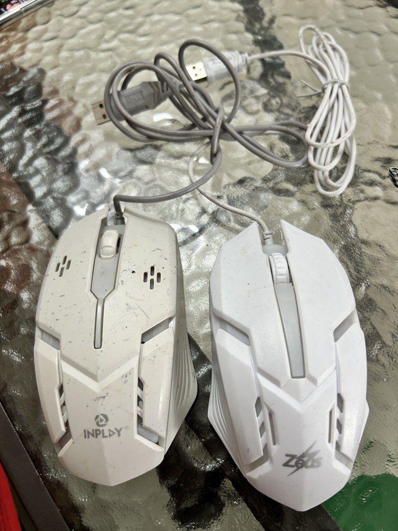 Inplay and Zeus Wired Gaming Mice Bundle (Category: Mouse & Mousepads) located in Cavite. Submitted by jm_gutierrez (Listing ID 1470385634, Image 1). Description: - Bundle includes 2 white wired gaming mice: Inplay (7-color LED lights) and Zeus - Standard USB plug-and-play connections - Condition: Pre-owned with visible dirt, scuffs, and handling marks from regular usage - Fully functional and sold as a pair - Great budget backup or starter mice.