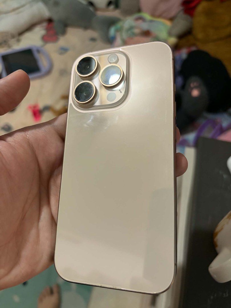 Iphone 16 Pro (Category: iPhone 16 Series) located in Manila. Submitted by icdkpi (Listing ID 1470476187, Image 3). Description: Iphone 16 Pro 128 gb Titanium Dessert 90% Battery Health No hidden issue • Free Original Pink Silicone Case.