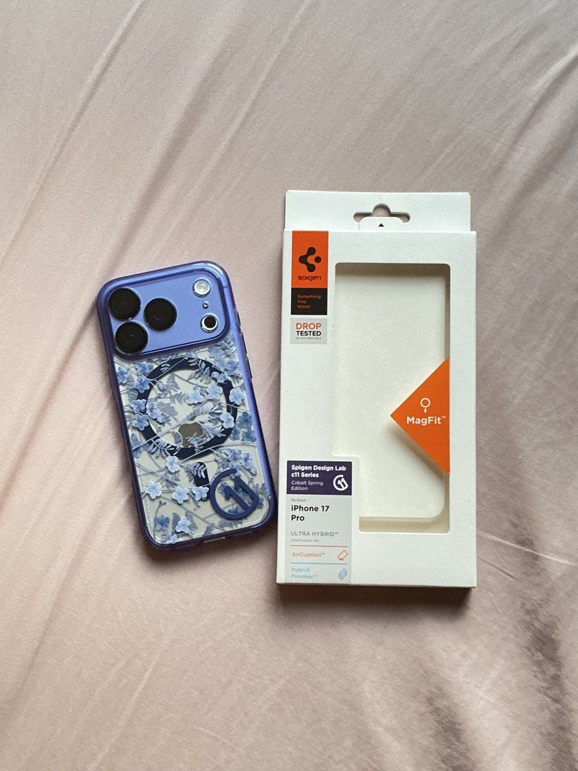 iphone 18/17 pro Spigen Magsafe case (Category: Cases & Sleeves) located in Manila. Submitted by mcpmcp (Listing ID 1470443254, Image 1). Description: Used for 2 days only. Bought from Spigen SM MOA. Strong magsafe. Flower design is 3D printed. Very beautiful in actual. Drop protection up to 6ft; camera plateau is covered as well so well protected. Color: Indigo/Violet/Violet-Blue No scratches. No damage. RFS: extra case. Full payment via gcash. 