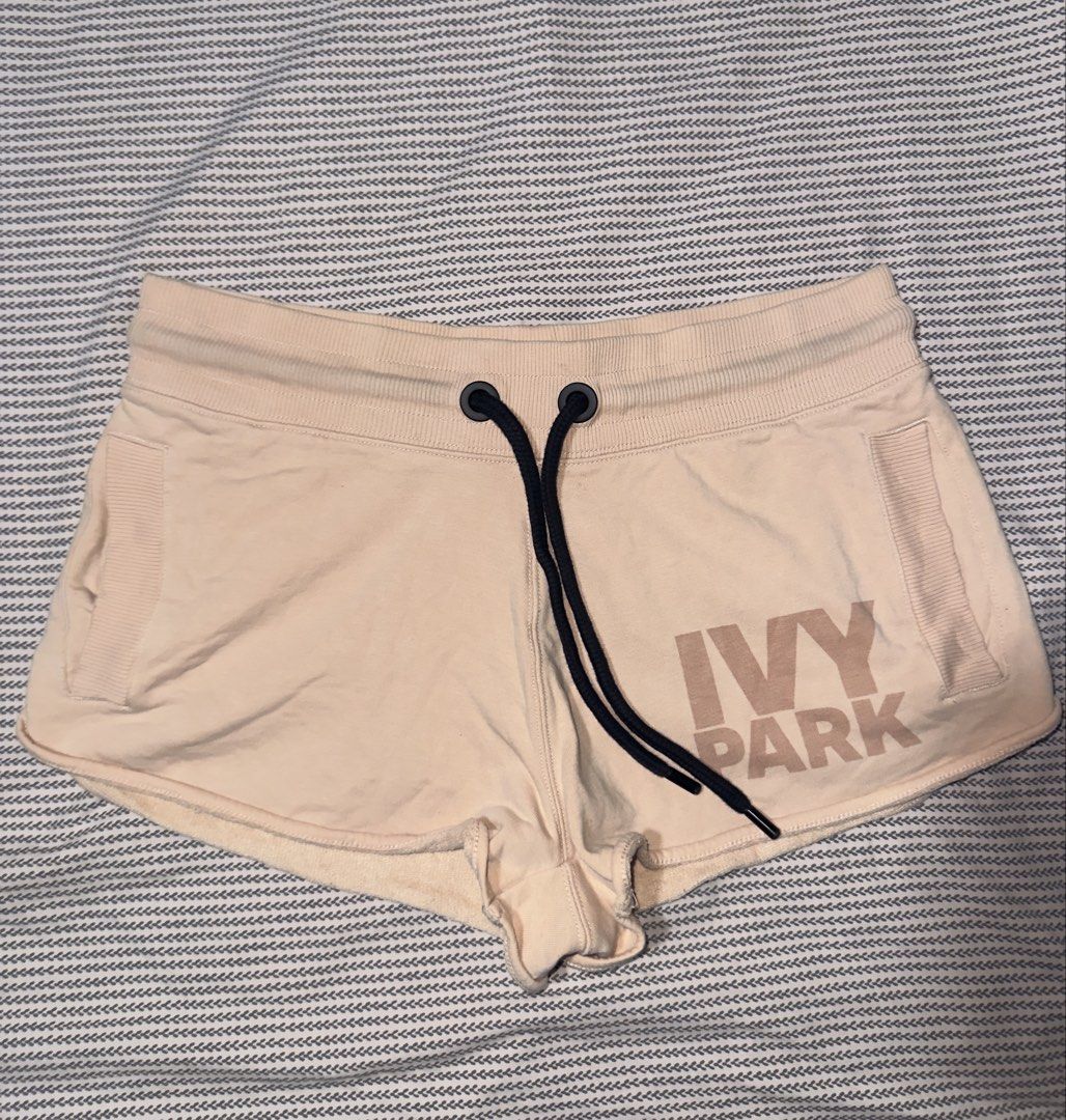 IVY PARK Sweatshorts Peach Size S (Category: Shorts) located in Santa Ana. Submitted by fatikilla (Listing ID 1470464407, Image 1). Description: - Brand: IVY PARK - Color: Peach with contrast black drawstring - Size: Small - Material: Soft fabric with ribbed side pocket panels - Design: Raw edge hem, elastic waistband, and large block logo on right leg - Origin: Made in Pakistan.