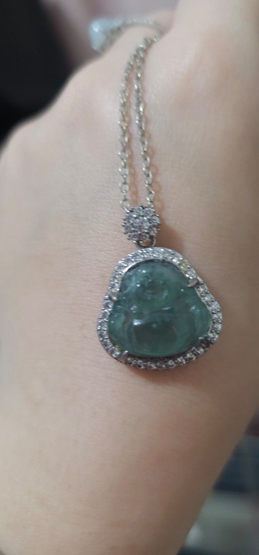 JADEITE Laughing Buddha Pendant (Category: Necklaces) located in Batangas. Submitted by finestonesandfindsph (Listing ID 1470459533, Image 2). Description: - Green jade laughing Buddha pendant set in silver-tone metal - Surrounded by a halo of small sparkling stones - Delicate flower-shaped cluster detail above the pendant - Comes with a free matching thin link chain - Catches the light beautifully with great sparkle - Traditional lucky piece and
