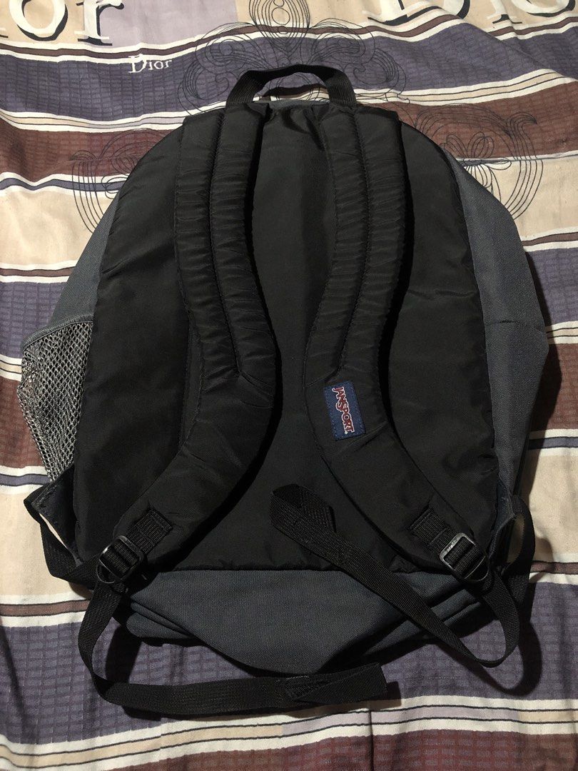 JanSport TDN7 Grey Backpack (Category: Backpacks) located in Manila. Submitted by bakithrift213 (Listing ID 1470455116, Image 2). Description: - Authentic JanSport backpack in classic grey - Made from durable 100% polyester - Multiple zippered compartments for easy organization - Convenient side mesh pocket for water bottles - Padded shoulder straps for all-day comfort - Includes hologram authenticity tag inside - Ideal for school, work, or daily